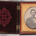 Lot 094 - Antique 1/6th Plate Daguerreotype Photograph Of Man In Full Thermoplastic Case With Abstract Floral Design, Brass Mat, Dark Red Cushion, Heavily Speckled Surface Of Photograph, Note Damage To Case