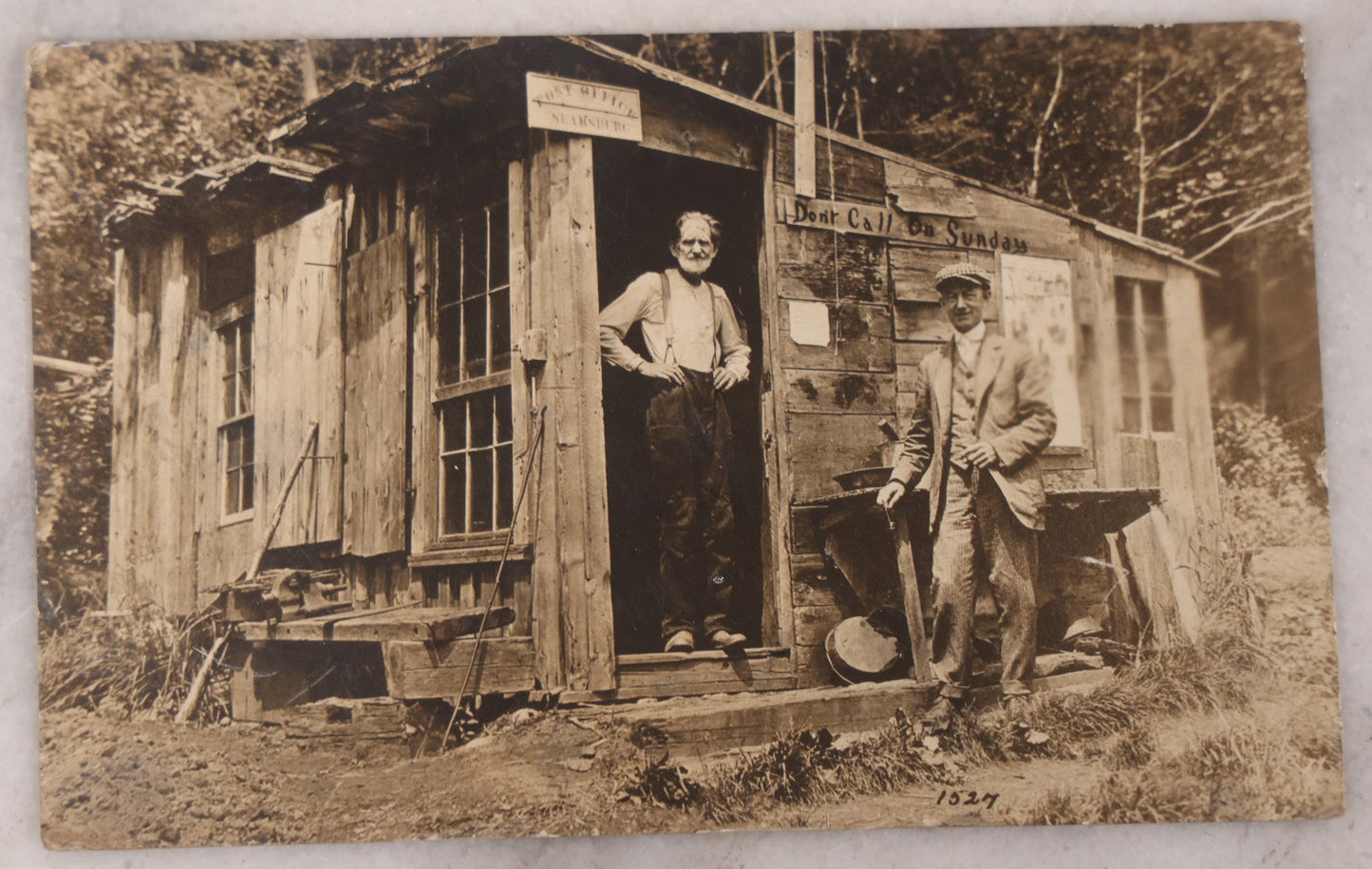 Lot 100 - Pair Of Antique Real Photo Postcards R.P.P.C., Including Photo Of Group Of Workers Posing With R.E. Newhall, Wholesale And Retail Ice Sign On Railroad Tracks, And Photo Of Two Men Posing At A Post Office Shack With Sign "Don't Call On Sunday"