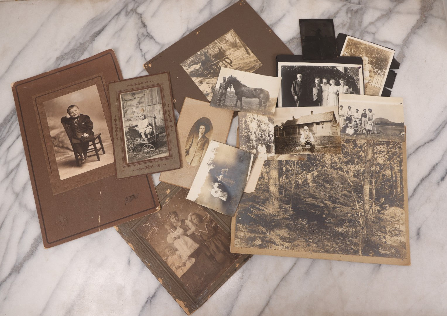 Lot 102 - Grouping Of 10+ Antique Photos With Various Subjects, Ephemera And More, Including Set Of Snapshot Album Pages Loosely Bound Without Covers, Tintype, Calling Card, And Boarded Photos