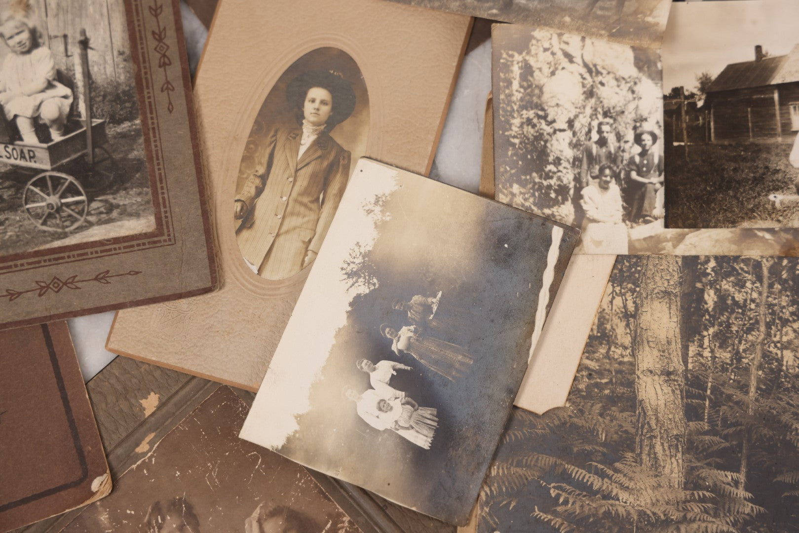 Lot 102 - Grouping Of 10+ Antique Photos With Various Subjects, Ephemera And More, Including Set Of Snapshot Album Pages Loosely Bound Without Covers, Tintype, Calling Card, And Boarded Photos