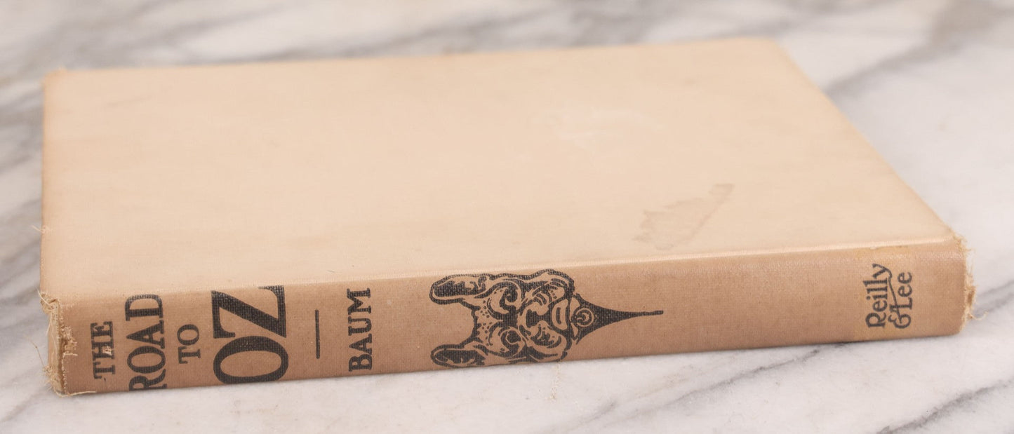 Lot 112 - "The Road To Oz" Antique Book By Frank L. Baum, Illustrated By John R. Neill, Ex-Library Copy, Published By The Reilly & Lee Co., Chicago, Copyright 1909