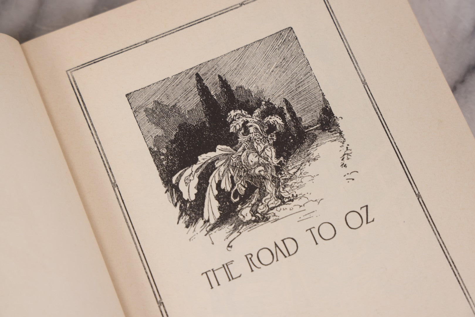 Lot 112 - "The Road To Oz" Antique Book By Frank L. Baum, Illustrated By John R. Neill, Ex-Library Copy, Published By The Reilly & Lee Co., Chicago, Copyright 1909