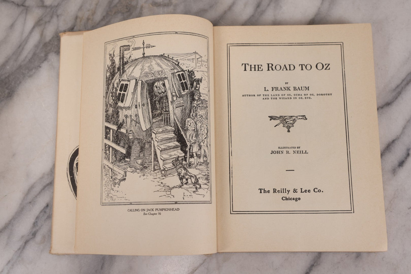 Lot 112 - "The Road To Oz" Antique Book By Frank L. Baum, Illustrated By John R. Neill, Ex-Library Copy, Published By The Reilly & Lee Co., Chicago, Copyright 1909