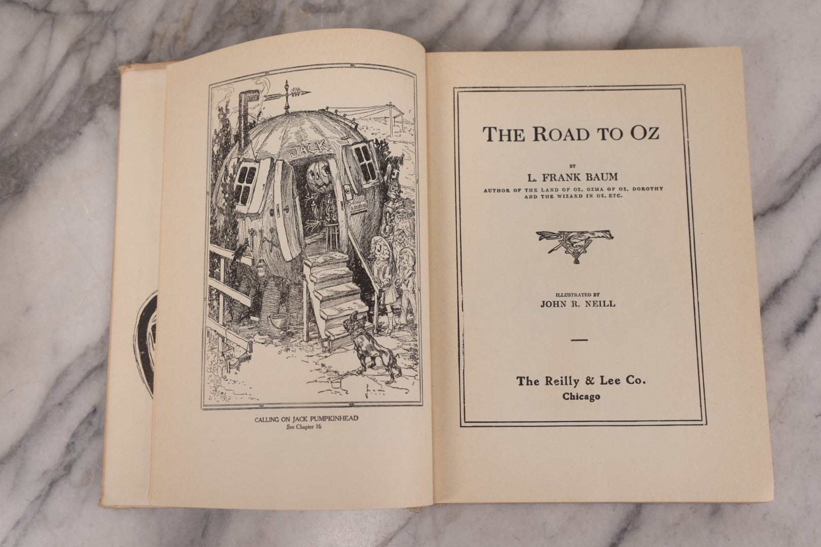 Lot 112 - "The Road To Oz" Antique Book By Frank L. Baum, Illustrated By John R. Neill, Ex-Library Copy, Published By The Reilly & Lee Co., Chicago, Copyright 1909