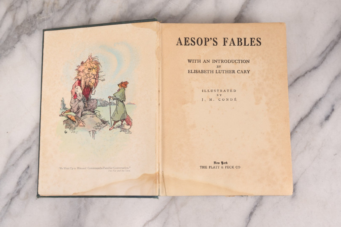 Lot 117 - "Aesop's Fables" Antique Book With Introduction By Elizabeth Luther Cary, Illustrated By J.M. Condé, Lithographed Cover, Published By The Platt & Peck Co., New York, Copyright 1913, Note Water Damage.