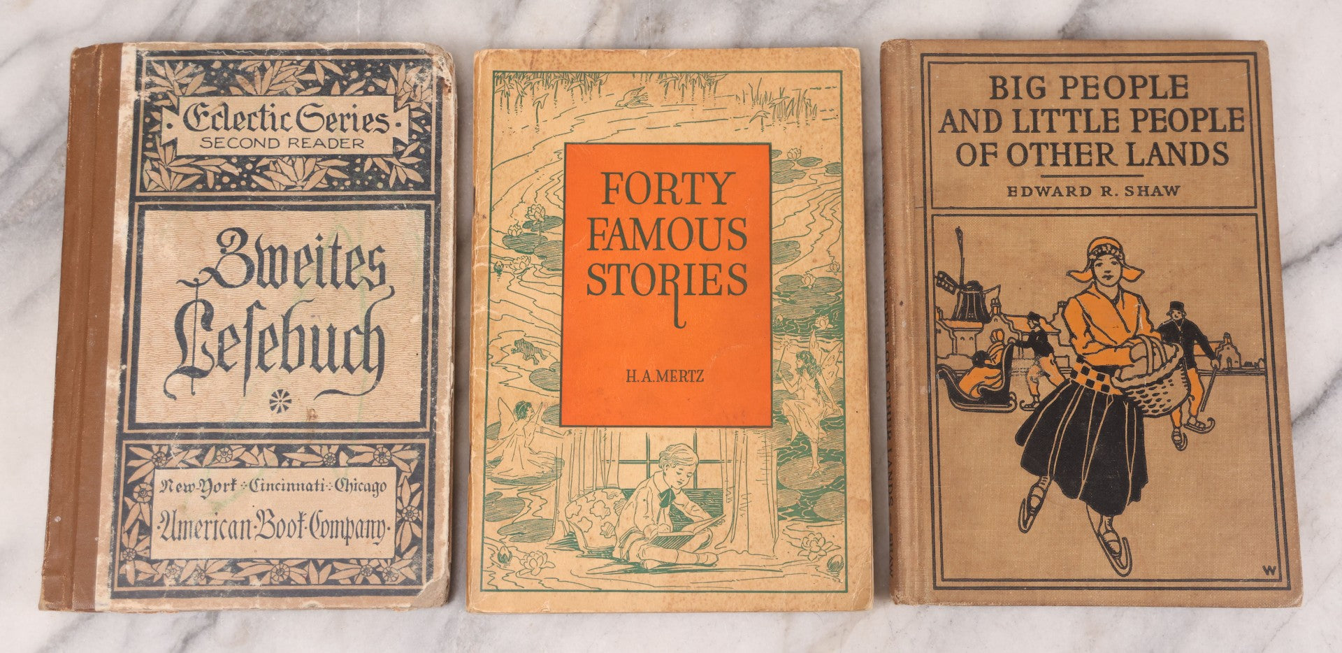 Lot 124 - Grouping Of Three Antique Books For Children: "Zweite Lesebuch" (Second Reader) German Language Instruction Book (1886), "Big People And Little People Of Other Lands" By Edward R. Shaw (1900), And "Forty Famous Stories" By H.A. Mertz (1936)
