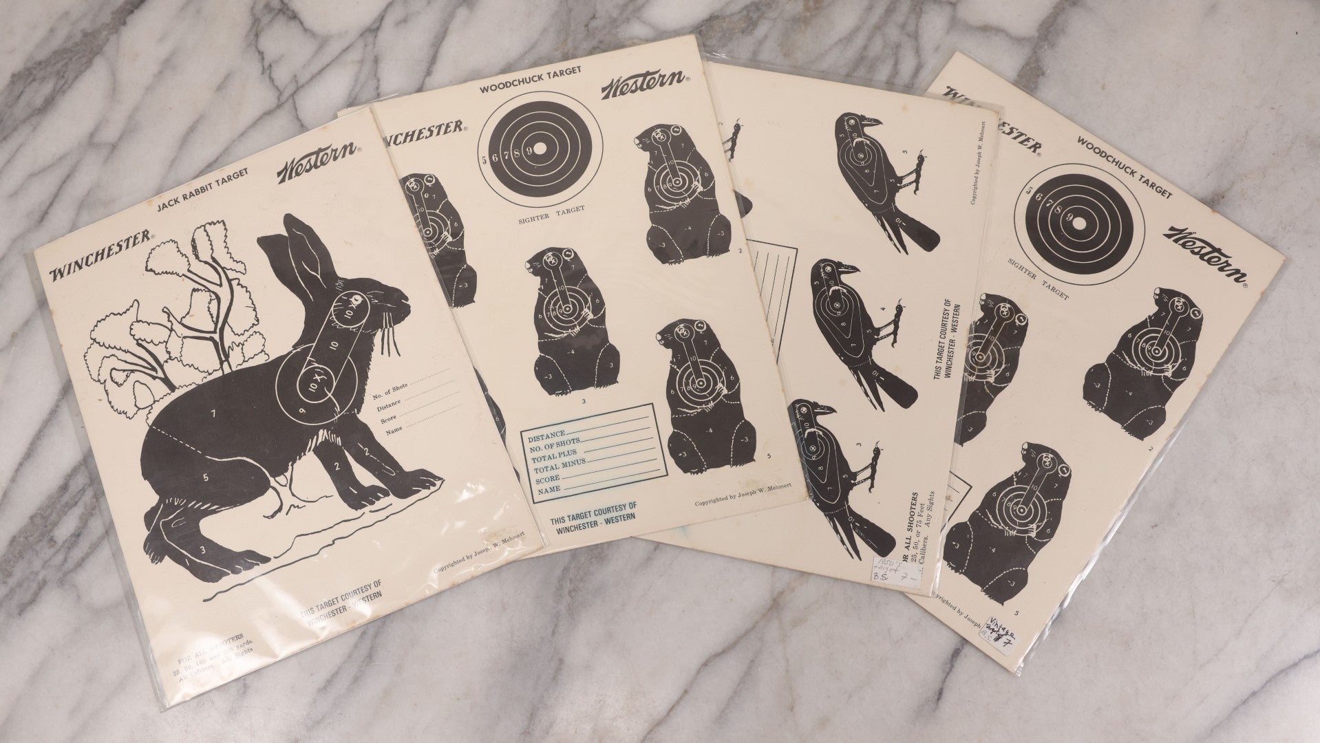 Lot 129 - Grouping Of Four Vintage Paper Winchester Western Rifle Shooting Targets Including Jack Rabbit, Crow, And Two Woodchuck Targets, Copyrighted By Joseph W. Mehmert