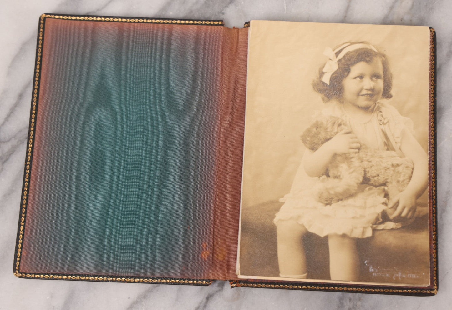 Lot 138 - Antique Leather Photo Album Book With Twelve Studio Portraits Of A Young Girl, Including Images With Her Stuffed Cat, Portraits By Underwood & Underwood, New York, Washington, And Chicago