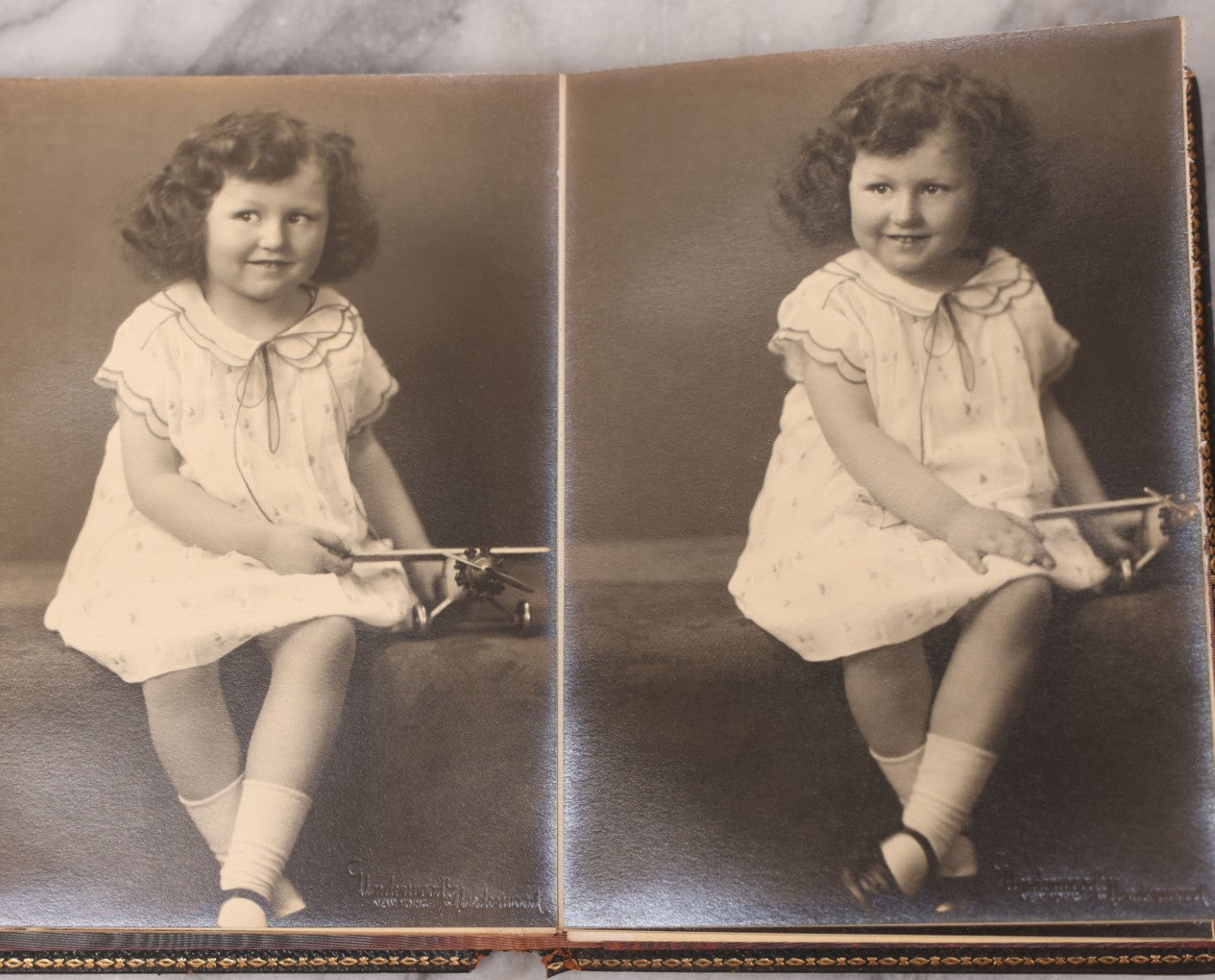 Lot 138 - Antique Leather Photo Album Book With Twelve Studio Portraits Of A Young Girl, Including Images With Her Stuffed Cat, Portraits By Underwood & Underwood, New York, Washington, And Chicago