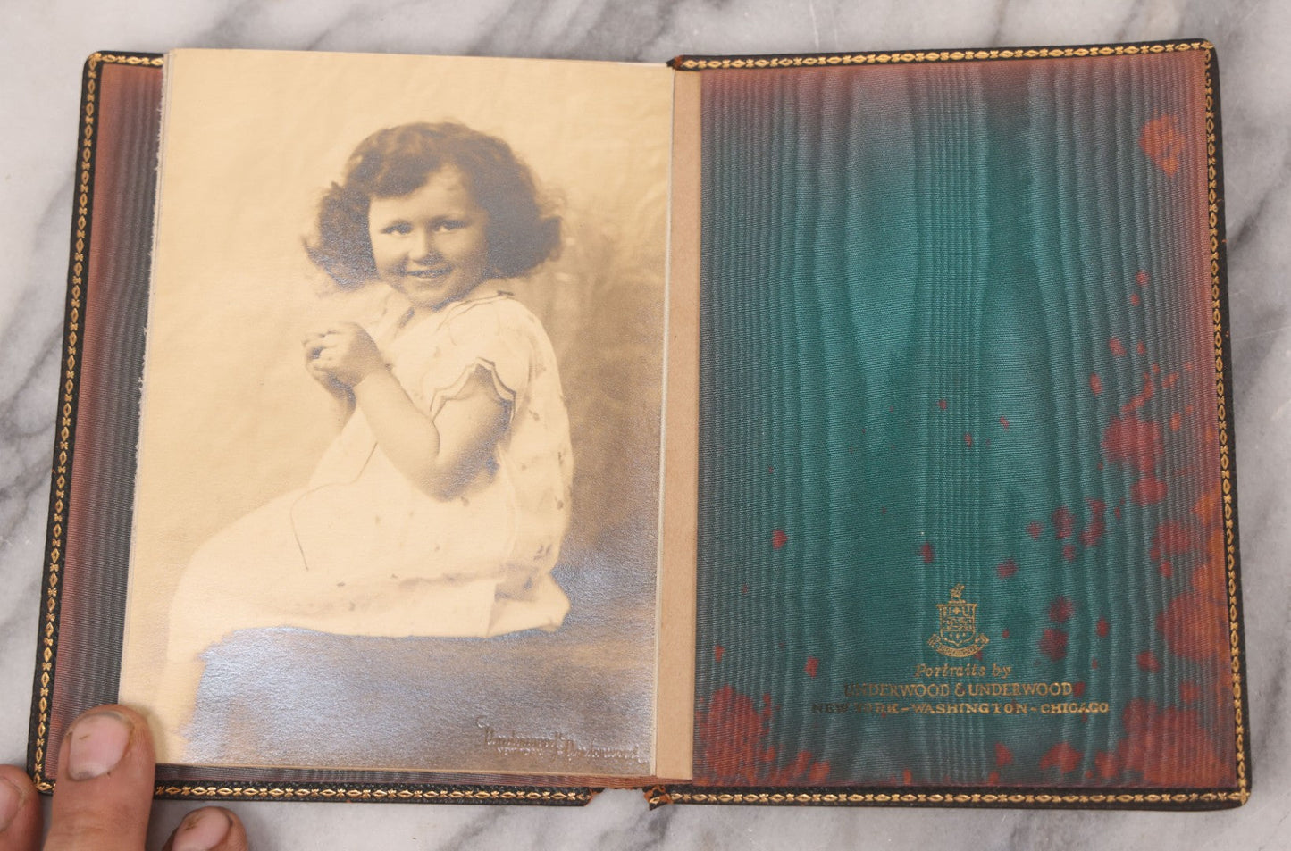 Lot 138 - Antique Leather Photo Album Book With Twelve Studio Portraits Of A Young Girl, Including Images With Her Stuffed Cat, Portraits By Underwood & Underwood, New York, Washington, And Chicago