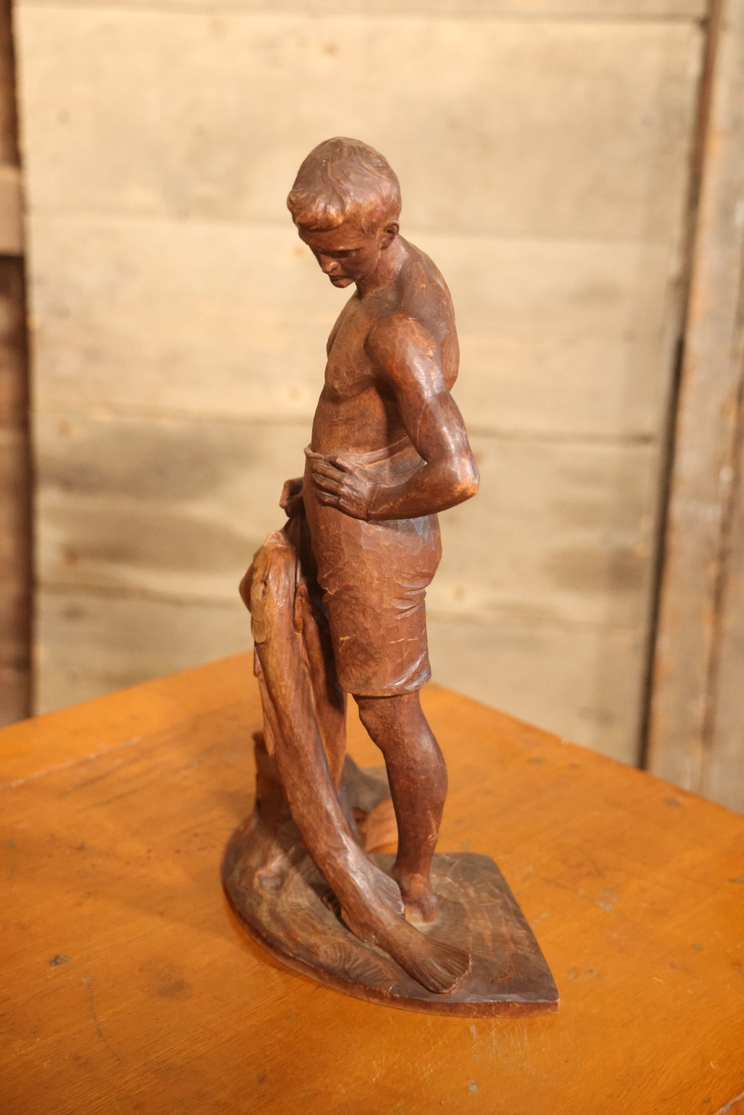Vintage Folk Art Hand Carved Wood Sculpture Of Boy Fisherman Holding Large Catch, 18-5/8" H