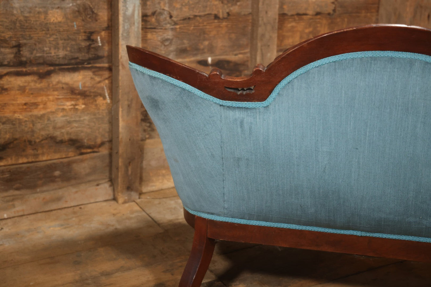 Antique Victorian Carved Walnut Settee With Tufted Blue Upholstery And Casters