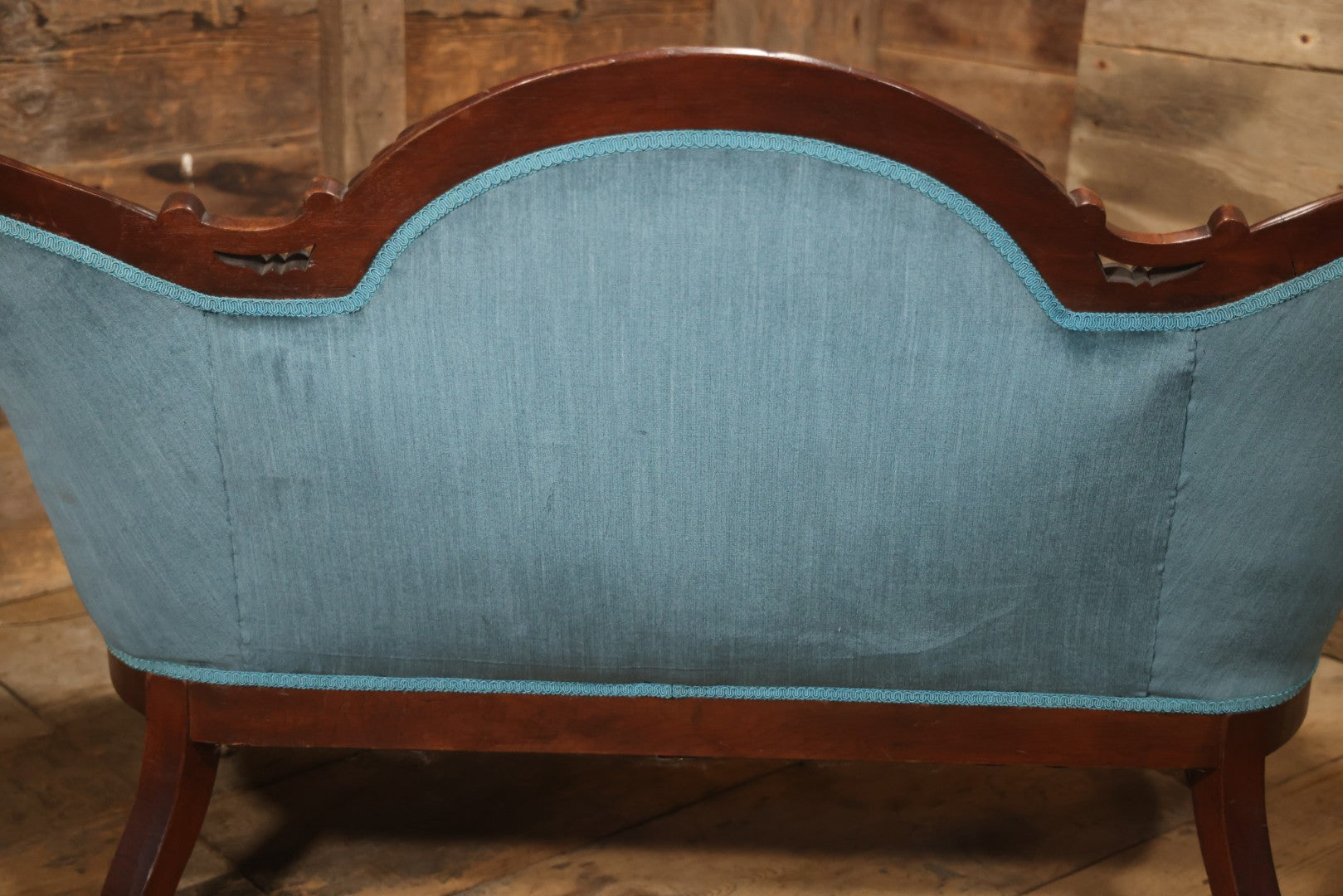 Antique Victorian Carved Walnut Settee With Tufted Blue Upholstery And Casters