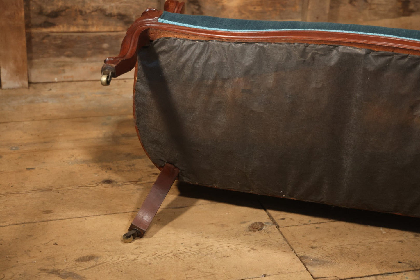 Antique Victorian Carved Walnut Settee With Tufted Blue Upholstery And Casters