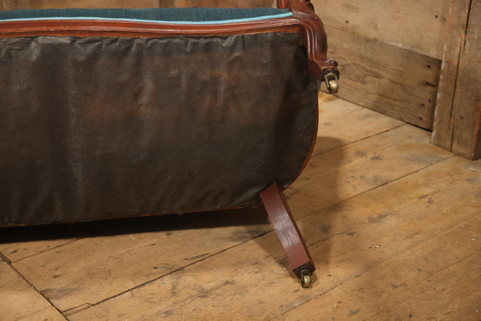 Antique Victorian Carved Walnut Settee With Tufted Blue Upholstery And Casters