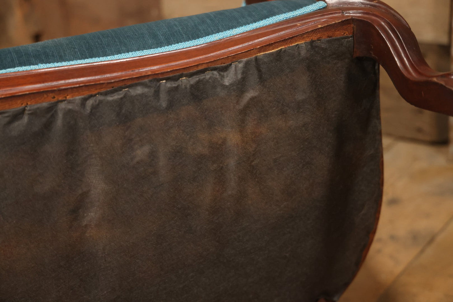 Antique Victorian Carved Walnut Settee With Tufted Blue Upholstery And Casters