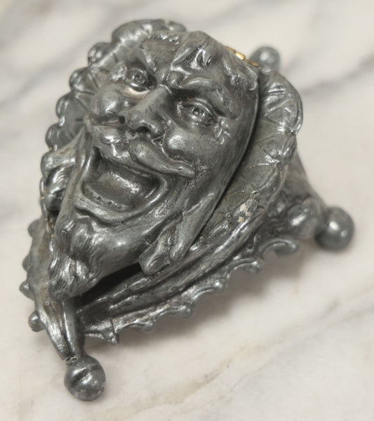 Lot 007 - Antique Pewter Figural Inkwell With Jester Head Motif And Glass Insert, Note Damaged Foot
