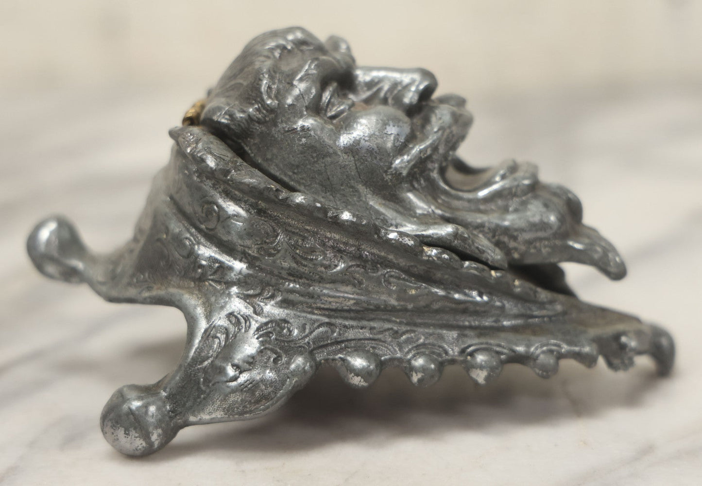 Lot 007 - Antique Pewter Figural Inkwell With Jester Head Motif And Glass Insert, Note Damaged Foot