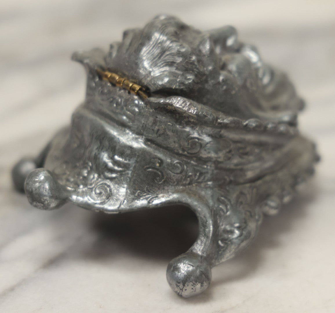 Lot 007 - Antique Pewter Figural Inkwell With Jester Head Motif And Glass Insert, Note Damaged Foot
