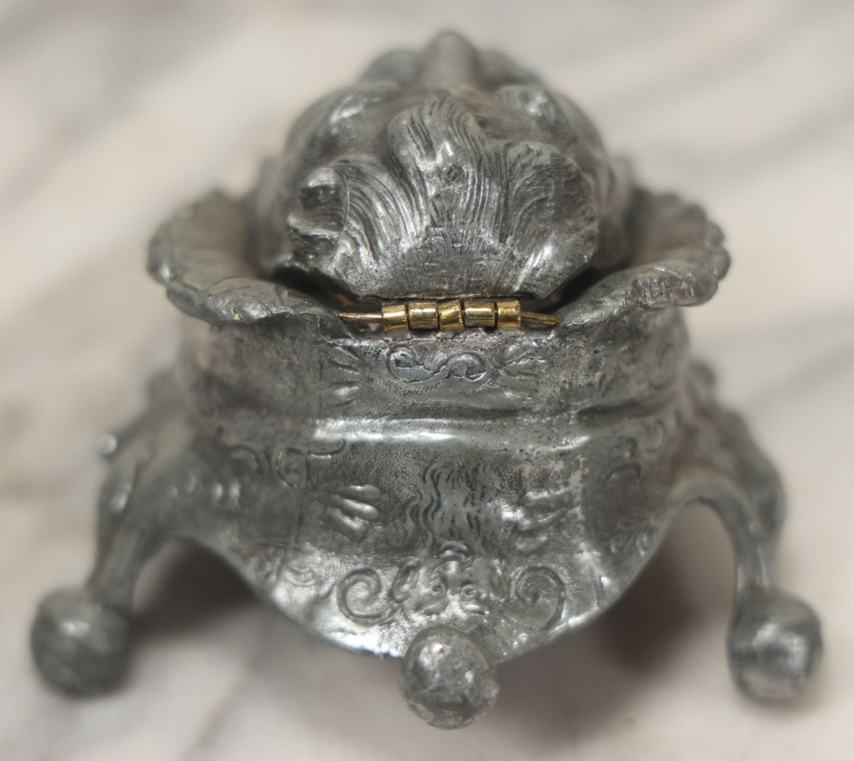 Lot 007 - Antique Pewter Figural Inkwell With Jester Head Motif And Glass Insert, Note Damaged Foot