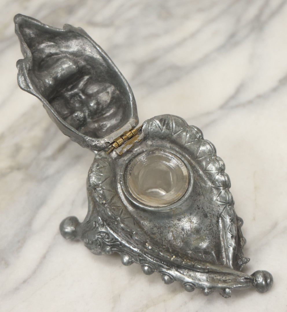 Lot 007 - Antique Pewter Figural Inkwell With Jester Head Motif And Glass Insert, Note Damaged Foot
