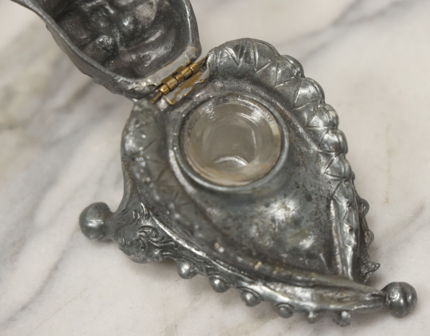 Lot 007 - Antique Pewter Figural Inkwell With Jester Head Motif And Glass Insert, Note Damaged Foot