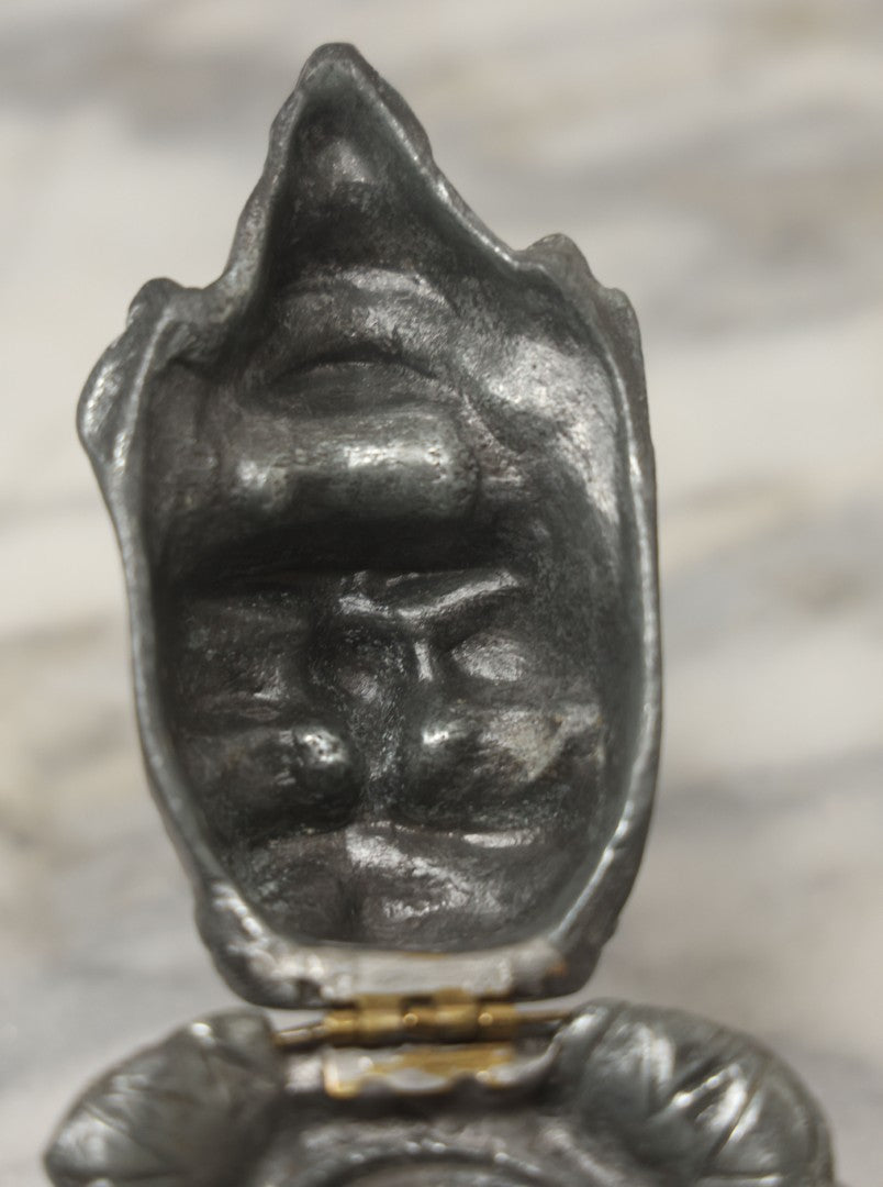 Lot 007 - Antique Pewter Figural Inkwell With Jester Head Motif And Glass Insert, Note Damaged Foot