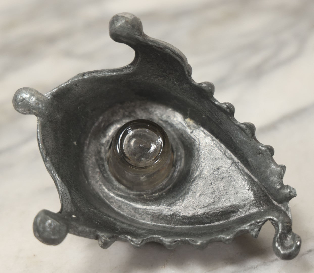 Lot 007 - Antique Pewter Figural Inkwell With Jester Head Motif And Glass Insert, Note Damaged Foot