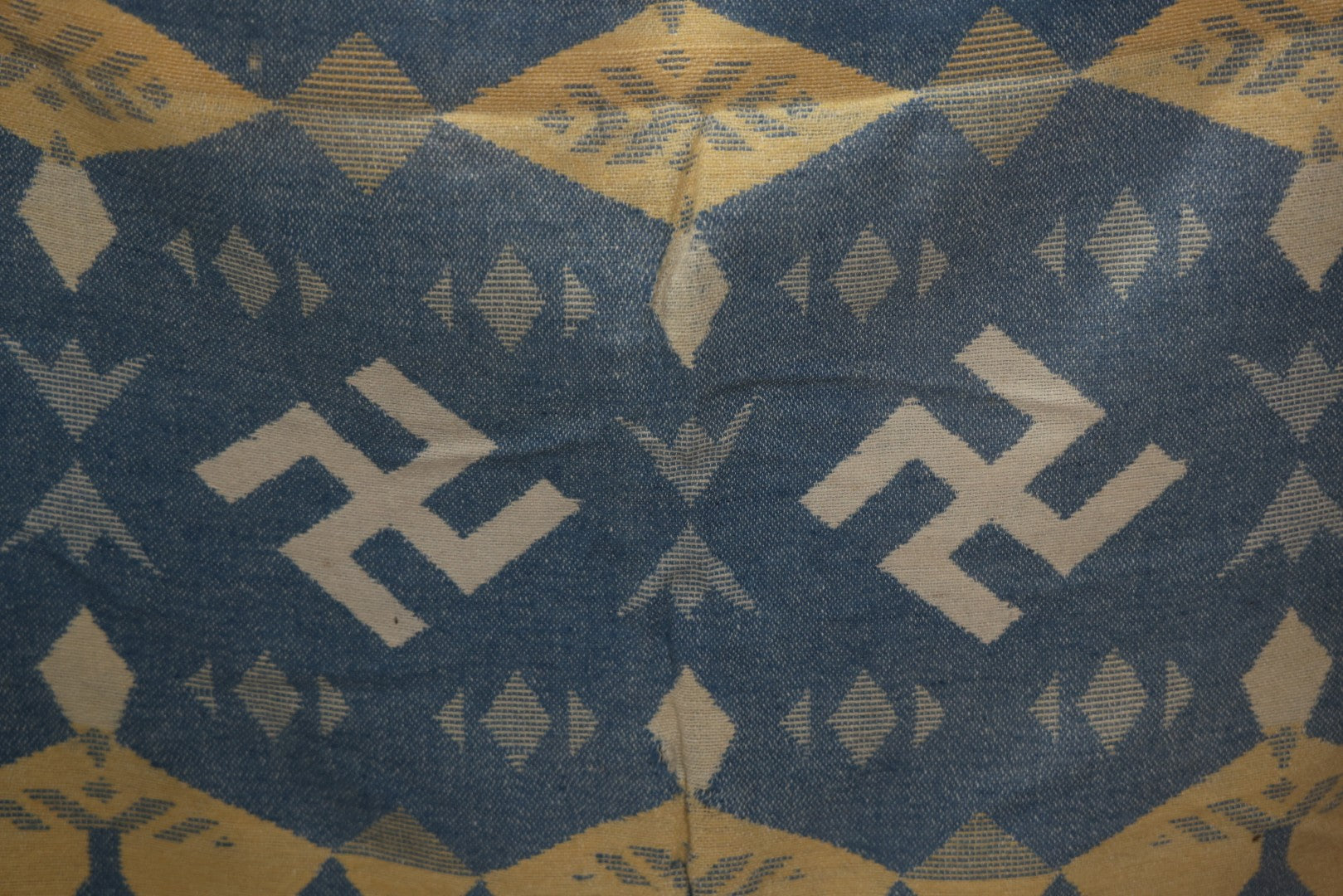 Lot 011 - Vintage Navajo-Style Textile Camp Blanket With Whirling Logs And Thunderbird Motifs, Blue And Yellow, Circa 1920s 60" x 70"