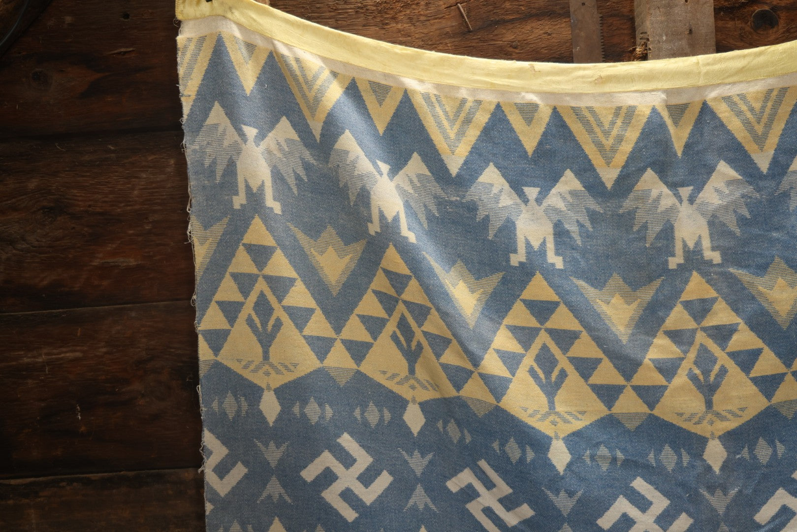 Lot 011 - Vintage Navajo-Style Textile Camp Blanket With Whirling Logs And Thunderbird Motifs, Blue And Yellow, Circa 1920s 60" x 70"