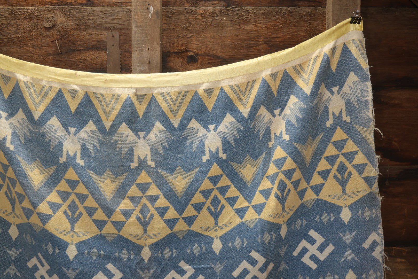 Lot 011 - Vintage Navajo-Style Textile Camp Blanket With Whirling Logs And Thunderbird Motifs, Blue And Yellow, Circa 1920s 60" x 70"