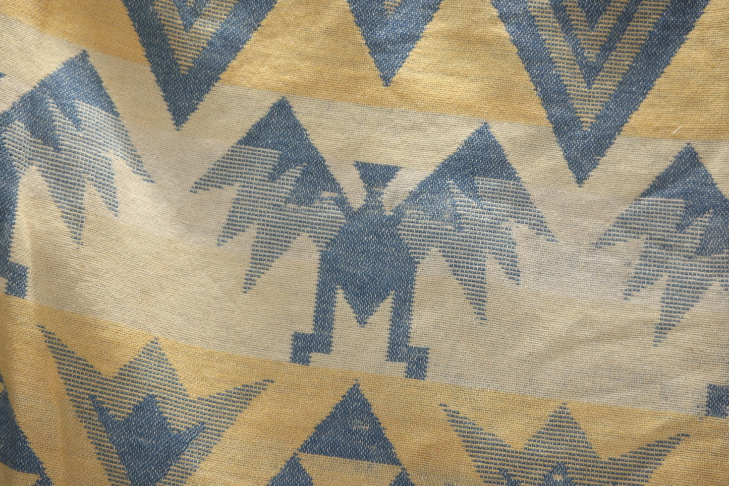 Lot 011 - Vintage Navajo-Style Textile Camp Blanket With Whirling Logs And Thunderbird Motifs, Blue And Yellow, Circa 1920s 60" x 70"