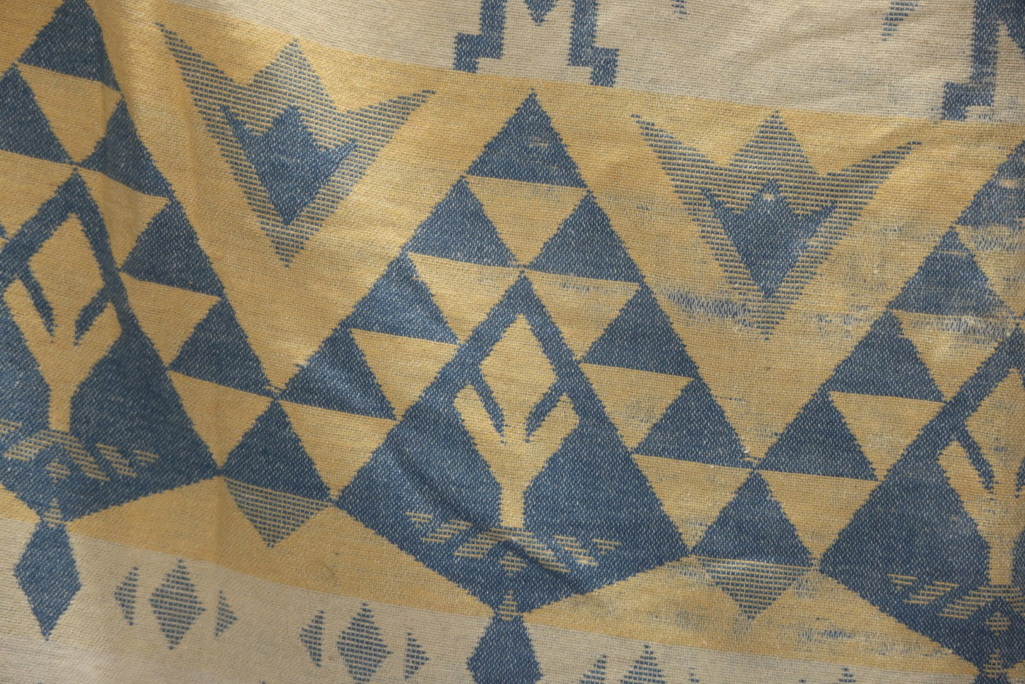 Lot 011 - Vintage Navajo-Style Textile Camp Blanket With Whirling Logs And Thunderbird Motifs, Blue And Yellow, Circa 1920s 60" x 70"