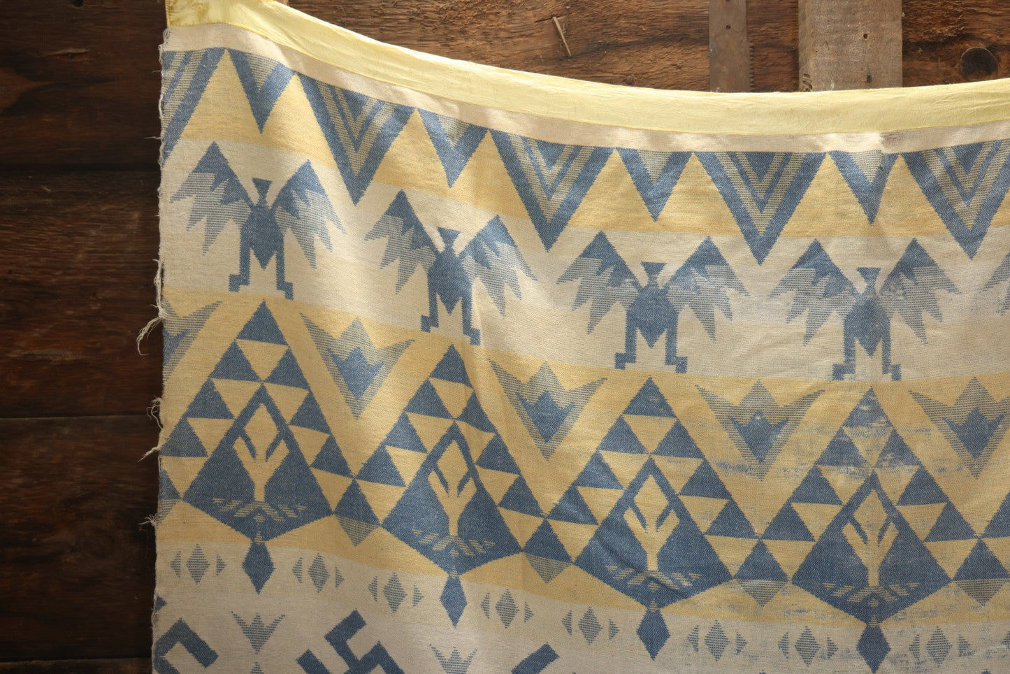 Lot 011 - Vintage Navajo-Style Textile Camp Blanket With Whirling Logs And Thunderbird Motifs, Blue And Yellow, Circa 1920s 60" x 70"