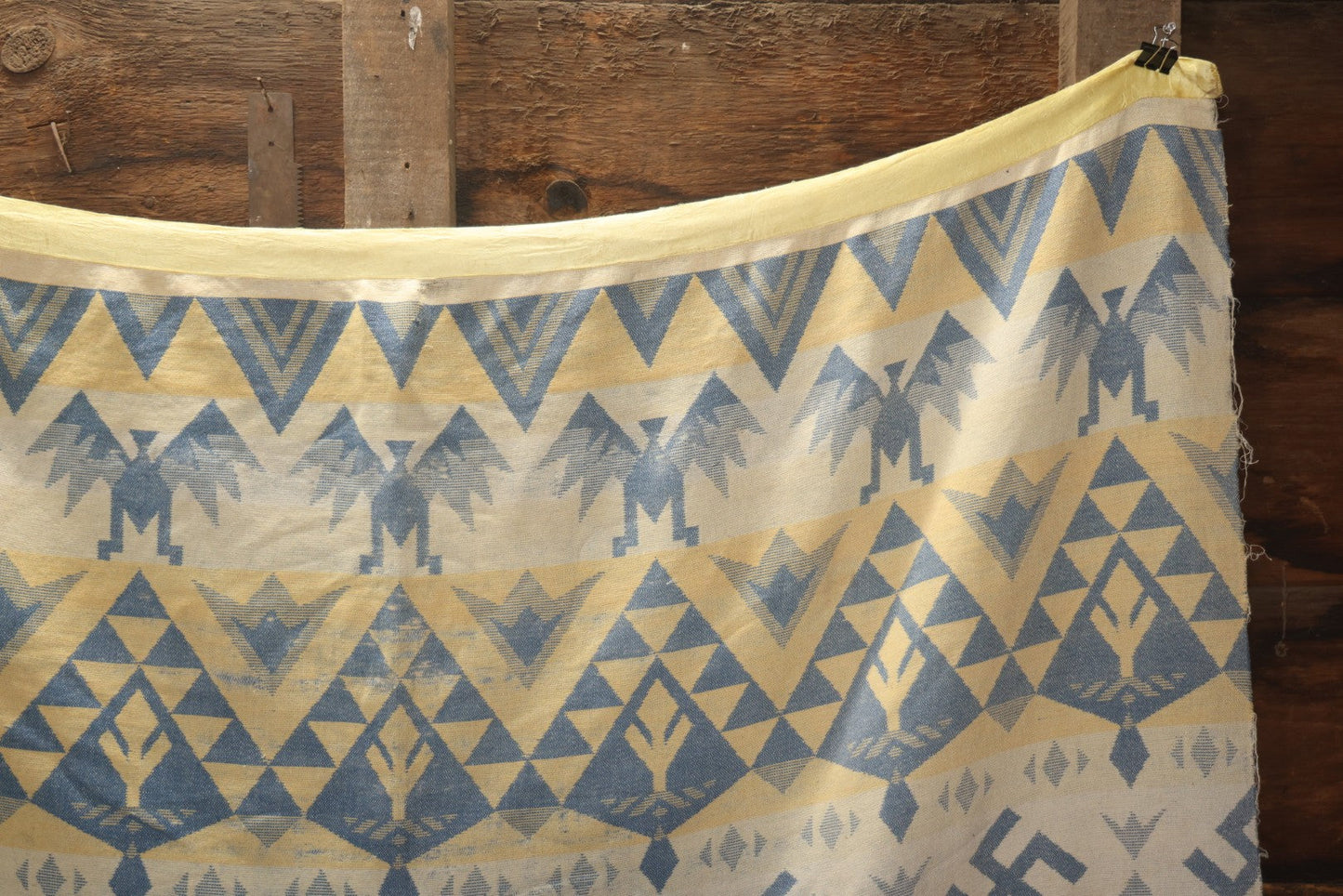 Lot 011 - Vintage Navajo-Style Textile Camp Blanket With Whirling Logs And Thunderbird Motifs, Blue And Yellow, Circa 1920s 60" x 70"