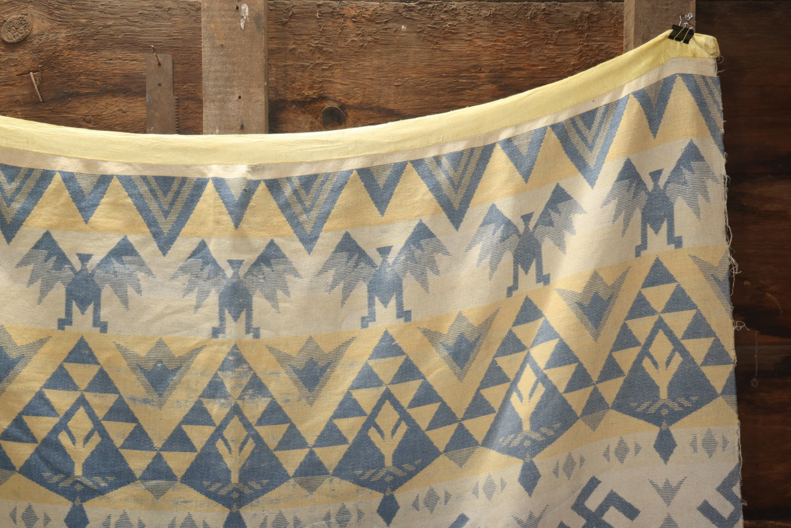 Lot 011 - Vintage Navajo-Style Textile Camp Blanket With Whirling Logs And Thunderbird Motifs, Blue And Yellow, Circa 1920s 60" x 70"
