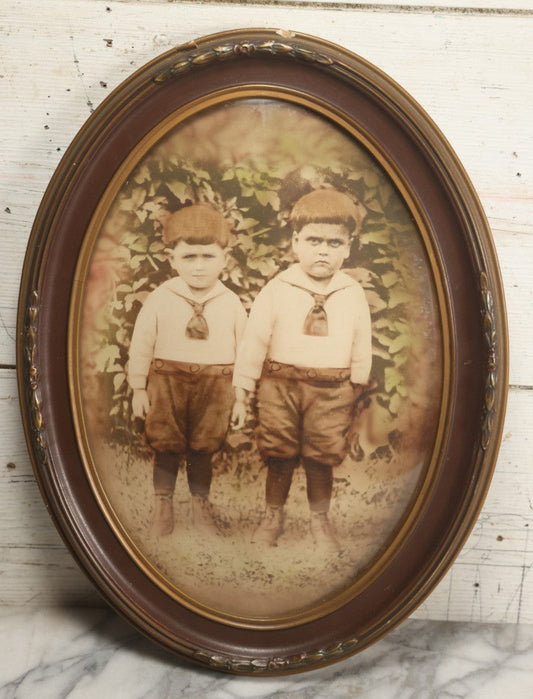 Lot 017 - Antique Sepia Toned Color Tinted Photograph Of Two Brothers In Matching Outfits In Bubble Glass Frame, 14-7/8" x 19-7/8"