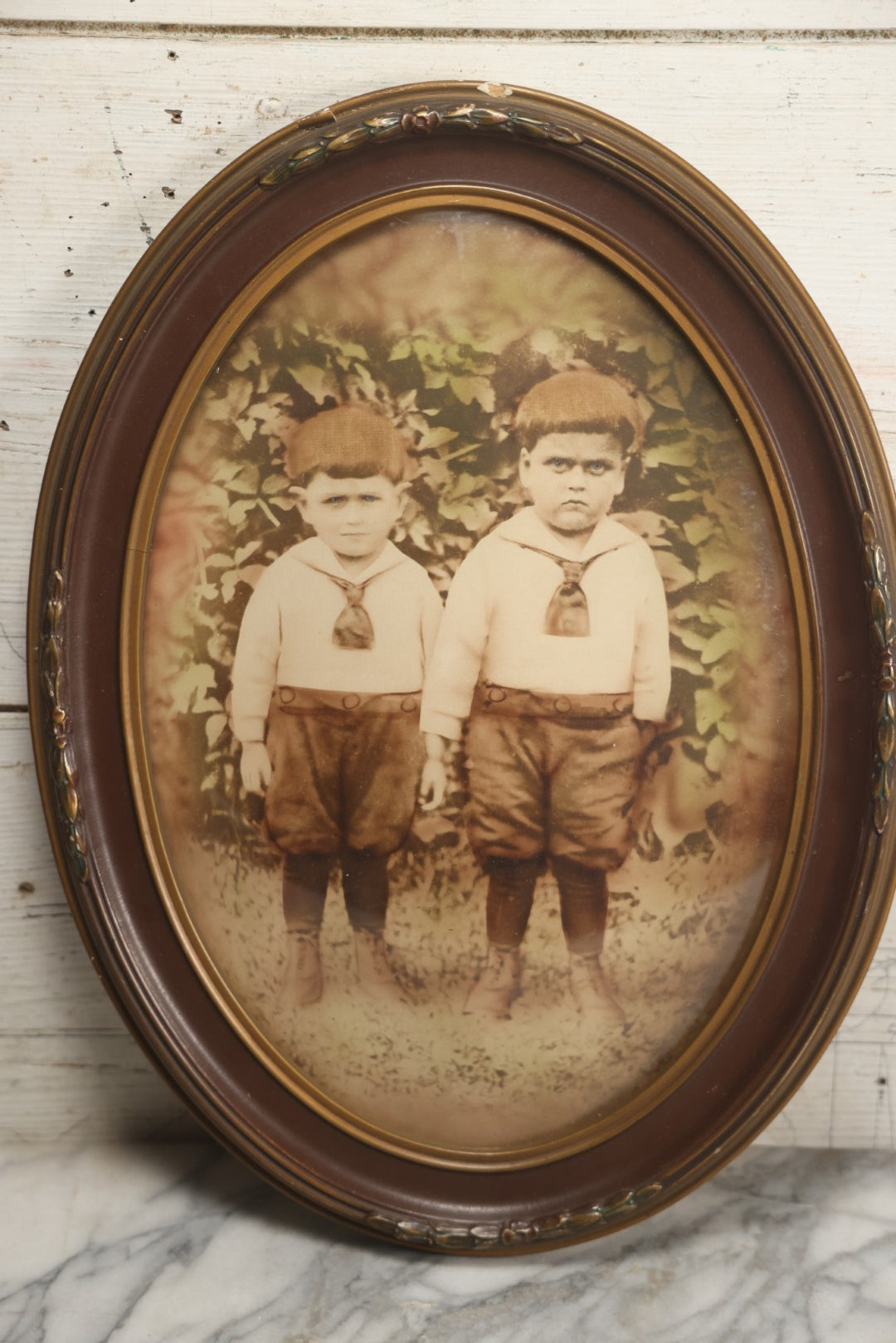Lot 017 - Antique Sepia Toned Color Tinted Photograph Of Two Brothers In Matching Outfits In Bubble Glass Frame, 14-7/8" x 19-7/8"