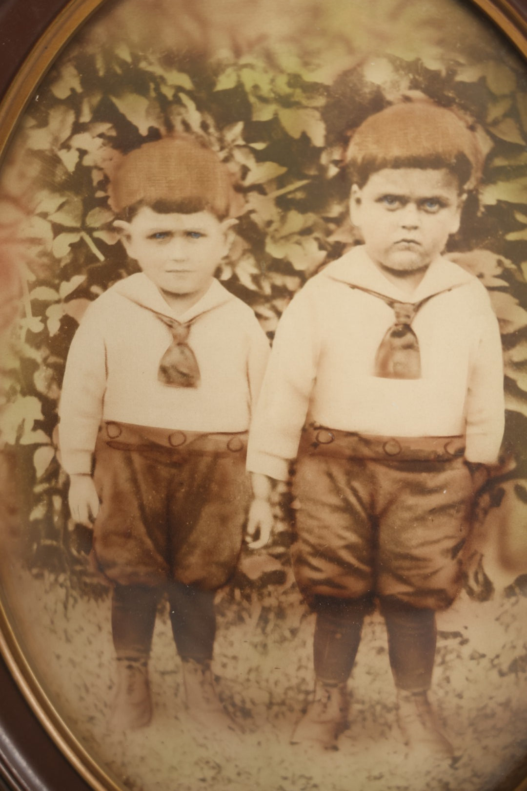 Lot 017 - Antique Sepia Toned Color Tinted Photograph Of Two Brothers In Matching Outfits In Bubble Glass Frame, 14-7/8" x 19-7/8"