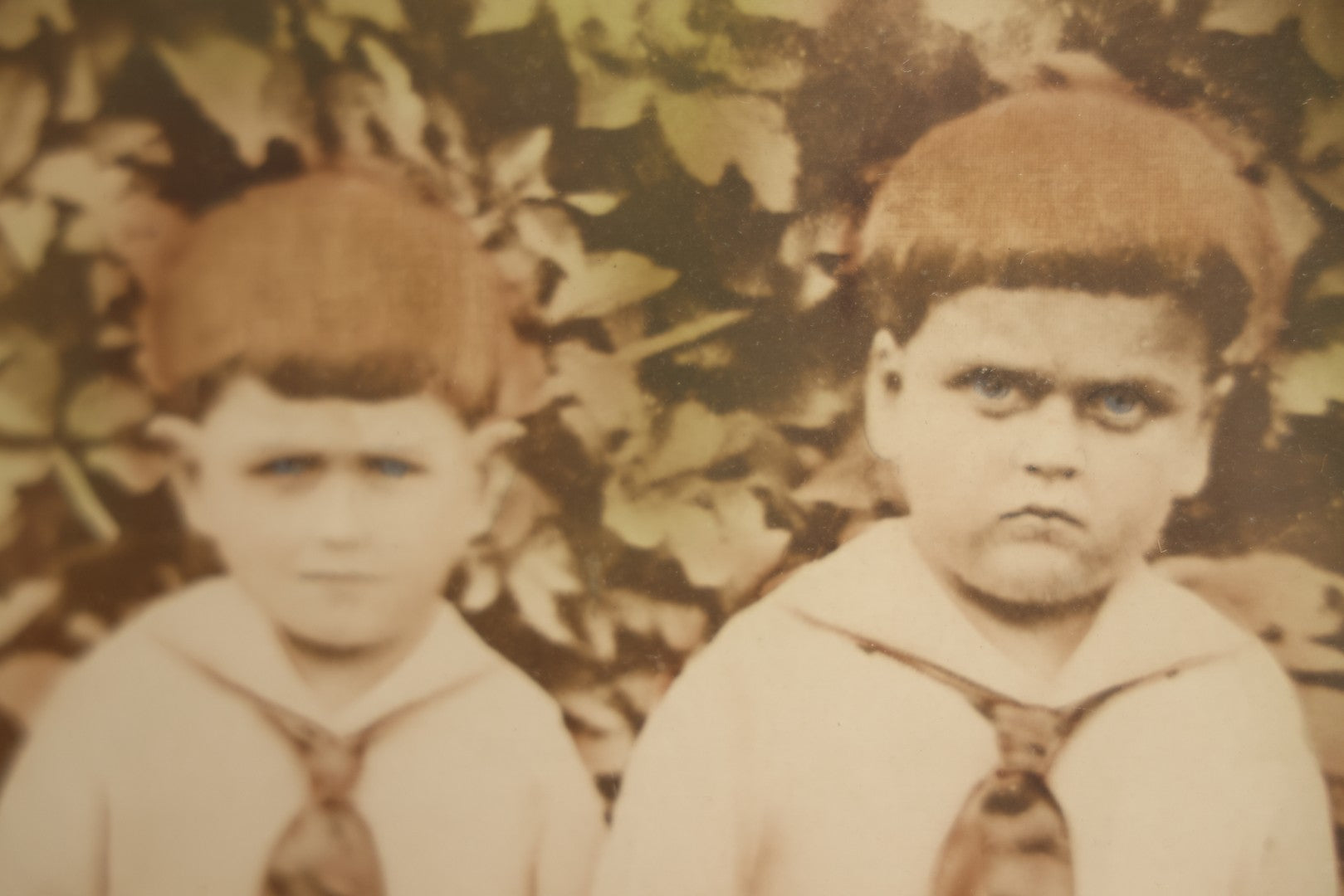 Lot 017 - Antique Sepia Toned Color Tinted Photograph Of Two Brothers In Matching Outfits In Bubble Glass Frame, 14-7/8" x 19-7/8"