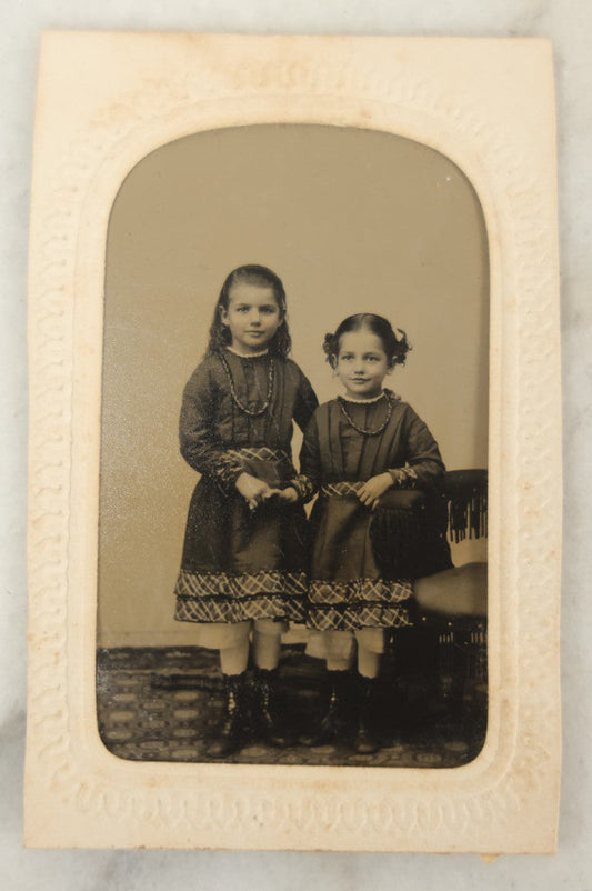 Lot 018 - Antique Tintype Photograph Of Two Smiling Sisters In Matching Outfits Holding Hands, In Paper Frame, Photographed By A.E. Alden, Springfield, Massachusetts