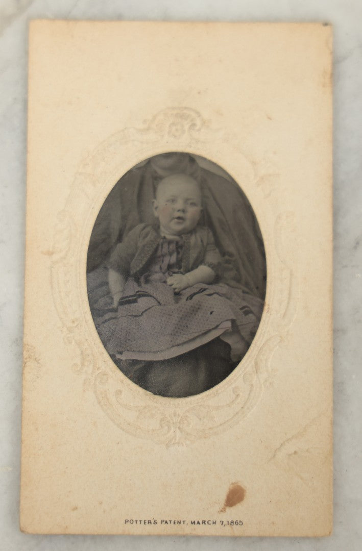 Lot 020 - Antique Not-So-Hidden Mother Tintype Photograph Of A Chubby Cheeked Baby With Mother's Chin Visible, In Paper Frame
