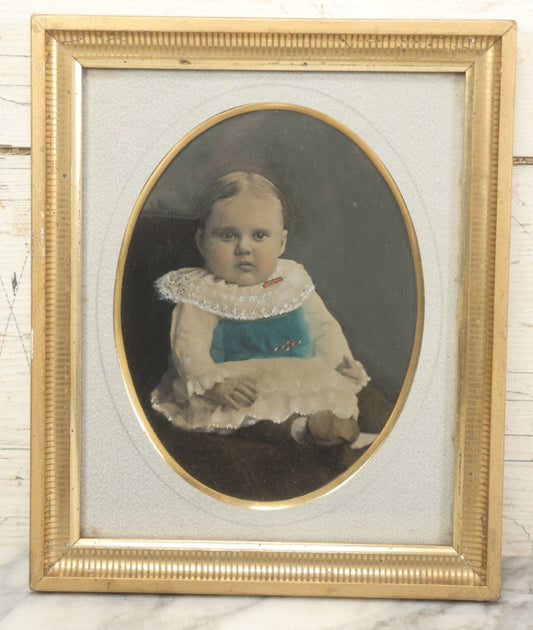 Lot 021 - Antique Full Plate Tintype Photograph Of A Chubby Baby With Ruffled Collar, Hand Tinted With Blue And White Coloring, In Frame, 9-1/2" x 11-1/2"