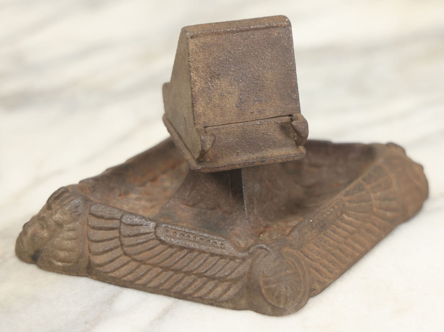 Lot 024 - Antique Cast Iron Egyptian Revival Match Book Holder Ashtray With Winged Scarab, Pharaoh Face Motifs, Marked With Illegible Patent Date, Circa 1920, Note Rust On Bottom