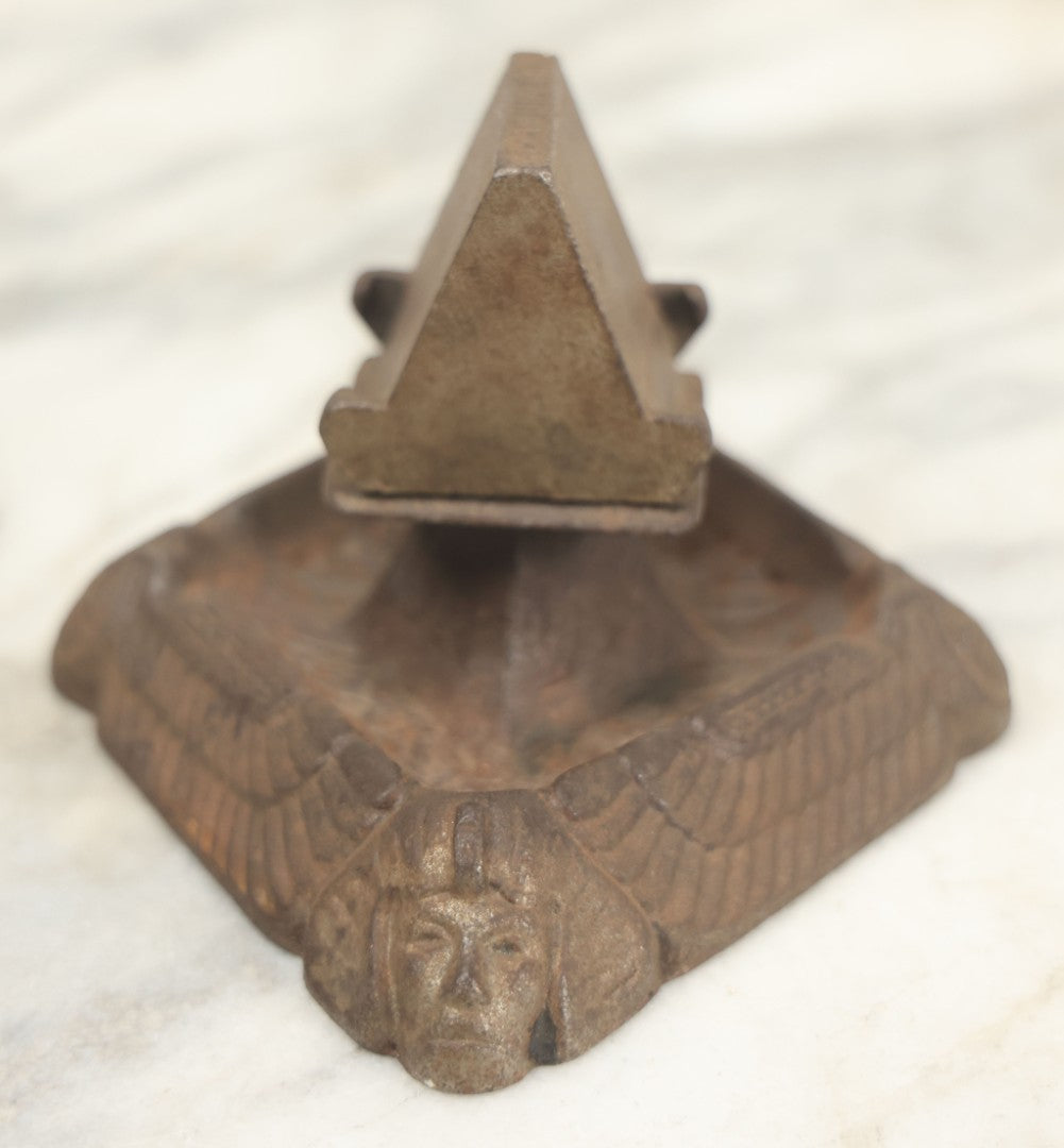 Lot 024 - Antique Cast Iron Egyptian Revival Match Book Holder Ashtray With Winged Scarab, Pharaoh Face Motifs, Marked With Illegible Patent Date, Circa 1920, Note Rust On Bottom