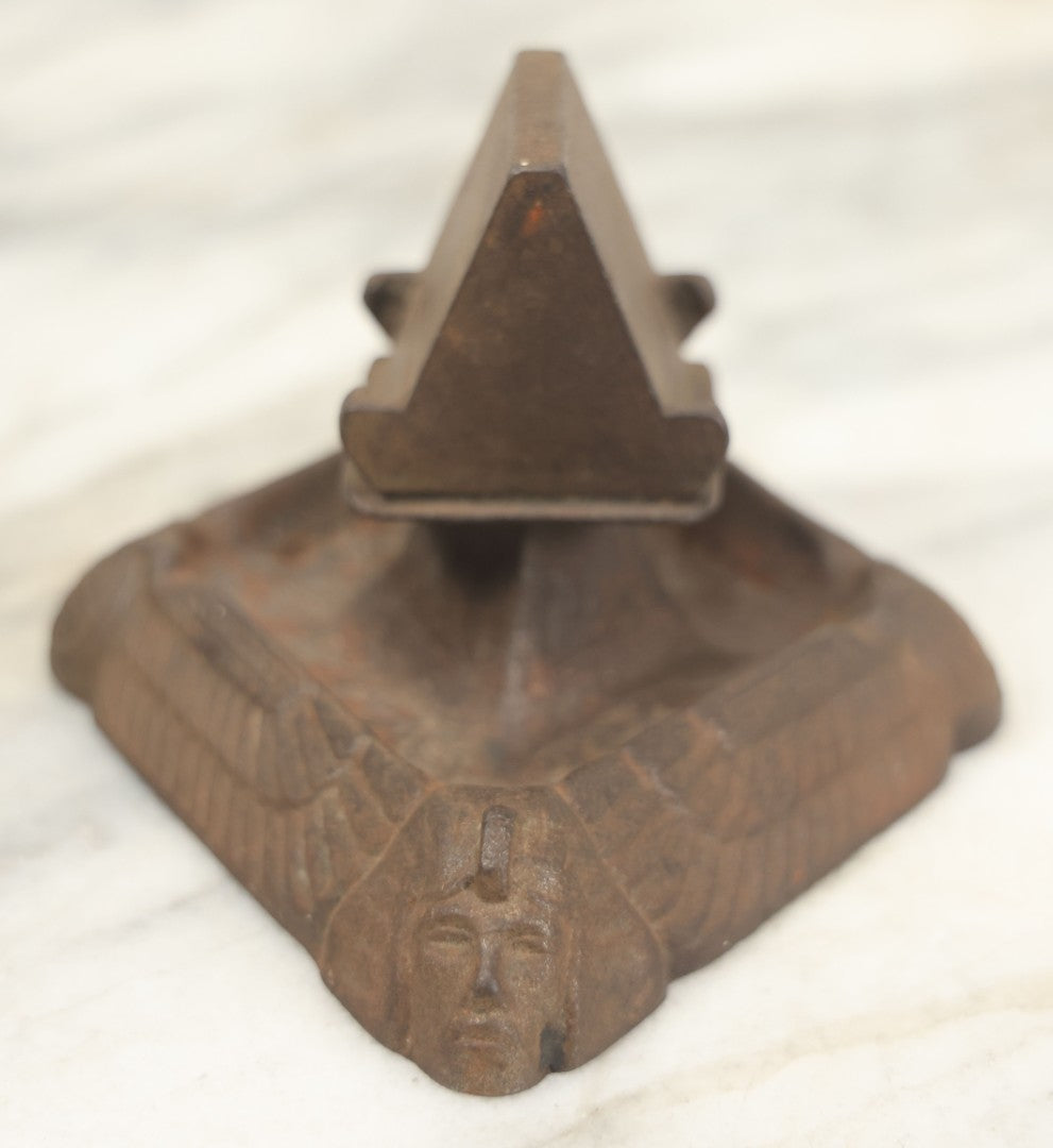 Lot 024 - Antique Cast Iron Egyptian Revival Match Book Holder Ashtray With Winged Scarab, Pharaoh Face Motifs, Marked With Illegible Patent Date, Circa 1920, Note Rust On Bottom