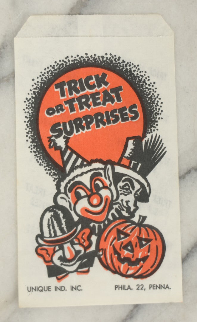 Lot 037 - Grouping Of Three N.O.S. New Old Stock Vintage Halloween Trick-Or-Treat Bags With Clown, Jack O'Lantern, And Costume Characters, “Trick Or Treat Surprises,” Unique Industries Inc., Philadelphia