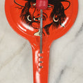 Lot 041 - Vintage Tin Lithograph Halloween Noisemaker With Snaggle-Toothed Witch On Orange Background, Made In U.S.A., 8-1/4" L