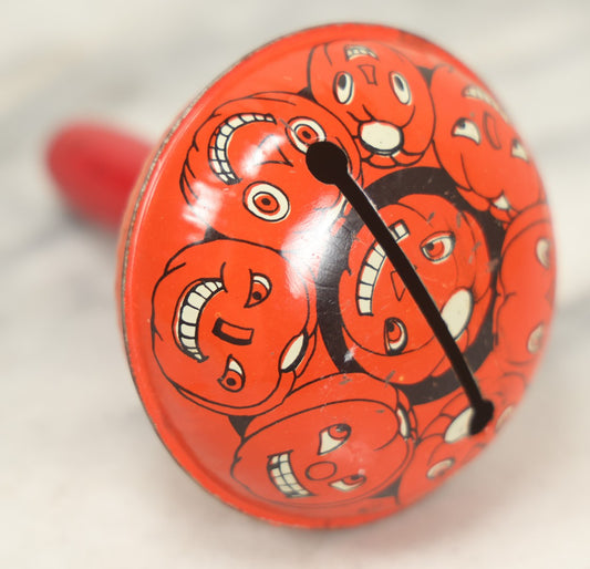 Lot 042 - Vintage Round Tin Lithograph Halloween Rattle Noisemaker With Jack-O'-Lantern Pumpkins Design