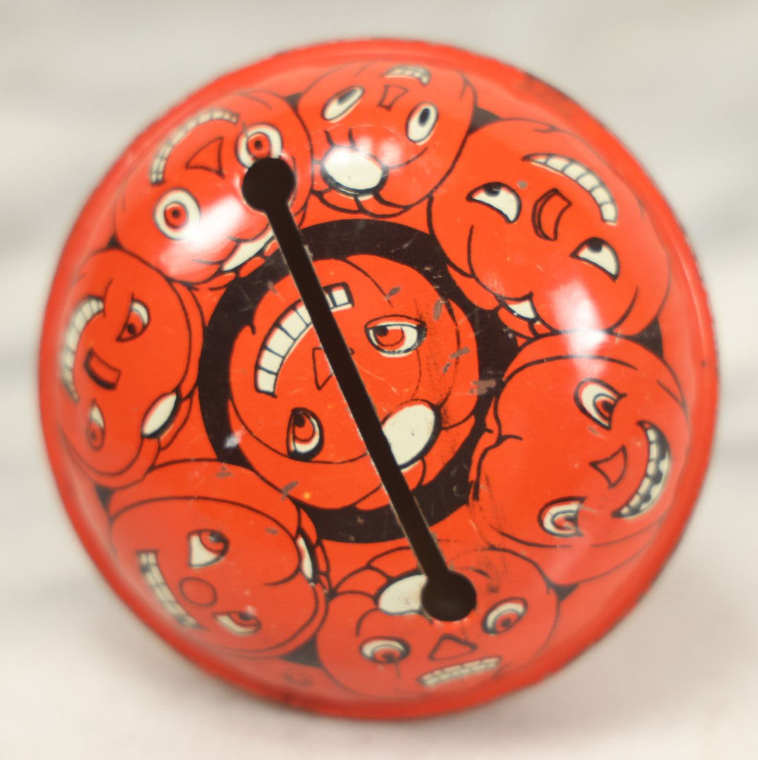 Lot 042 - Vintage Round Tin Lithograph Halloween Rattle Noisemaker With Jack-O'-Lantern Pumpkins Design